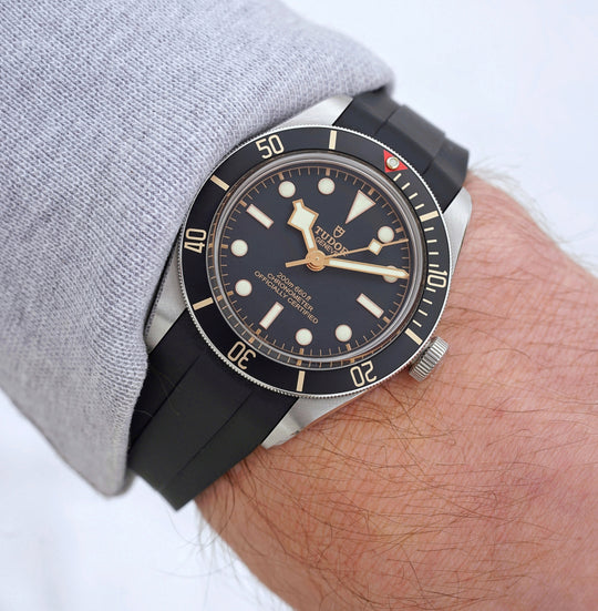 Tudor Black Bay 58 with a black strap on wrist